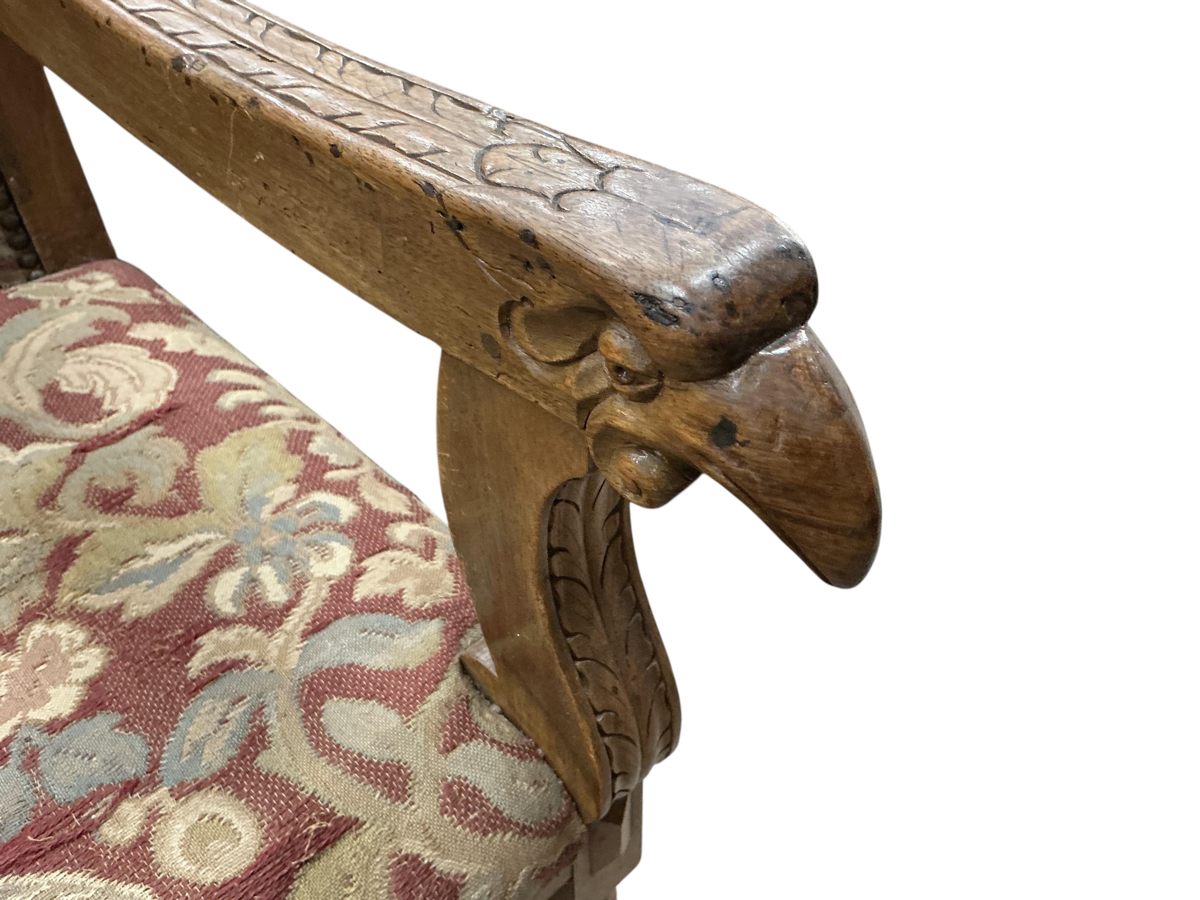 An 18th century style carved walnut elbow chair, width 56cm, depth 54cm, height 111cm